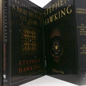 May include: A deluxe set of Stephen Hawking's "A Brief History of Time" and "The Universe in a Nutshell" books. The covers are black with gold and red lettering. The books are displayed open, showcasing the titles and author's name.
