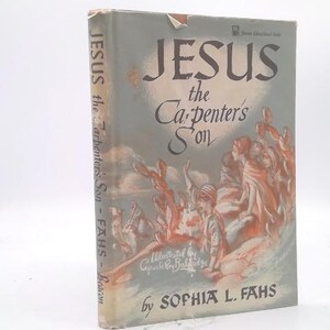 May include: A vintage book titled "JESUS the Carpenter's Son" by Sophia L. Fahs. The cover features an illustration of figures in a landscape with muted tones of blue, orange, and white. The book's spine reads "JESUS the Carpenter's Son - FAHS - Beacon".