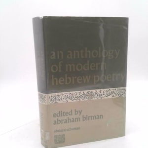 May include: A hardcover book titled "an anthology of modern hebrew poetry." The book has a dark gray cover with gold lettering. The lower portion of the book is tan with text and a decorative border.