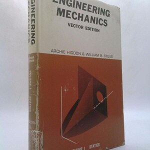 May include: A vintage hardcover book titled "Engineering Mechanics Vector Edition" by Archie Higdon & William B. Stiles. The cover is a mix of white and brown with geometric shapes and text. The book is Volume I: Statics.