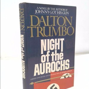 May include: A blue hardcover book titled "Night of the Aurochs" by Dalton Trumbo. The book cover features a swastika and the text "A novel by the author of Johnny Got His Gun".