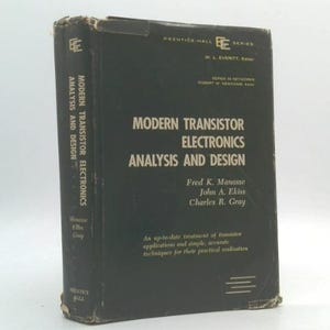 May include: A vintage, hardcover book titled "Modern Transistor Electronics Analysis and Design" by Fred K. Manasse, John A. Ekiss, and Charles R. Gray. The book is dark gray with white text and shows signs of wear.