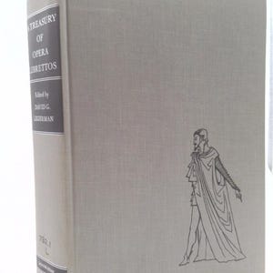 May include: A hardcover book titled "A Treasury of Opera Librettos" edited by David G. Legerman. The book is light gray with a line drawing of a man on the cover. The spine has the title and editor's name.