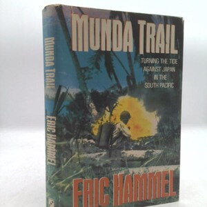 May include: A book cover with a jungle scene and the title "MUNDA TRAIL: TURNING THE TIDE AGAINST JAPAN IN THE SOUTH PACIFIC" by Eric Hammel.