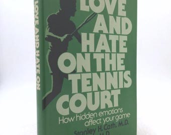May include: A green book titled "Love and Hate on the Tennis Court." The cover features a black silhouette of a tennis player and white text. The book's subtitle reads "How hidden emotions affect your game."