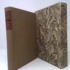 May include: A hardcover book titled "The Life of Samuel Johnson" by James Boswell. The book has a brown cover with a maroon label. The book is next to a marbled box with a swirling pattern in shades of brown and cream.