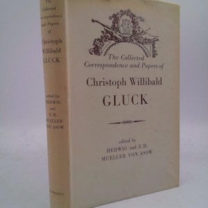 May include: A vintage book titled "The Collected Correspondence and Papers of Christoph Willibald Gluck." The book has a cream-colored cover with black text and decorative elements. The spine displays the author's name and title.