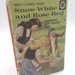 May include: A vintage Ladybird book cover featuring an illustration of Snow White and Rose Red with a dwarf. The book title is "Snow-White and Rose-Red" and the subtitle is "A Ladybird 'Easy-Reading' Book".