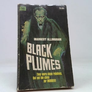 May include: A vintage paperback book titled "Black Plumes" by Margery Allingham. The cover features a green-toned illustration of a man in a dark coat. The title is in large white letters, with the tagline "They were close relatives. But not too close for MURDER!"