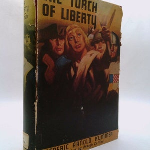 May include: The Torch of Liberty book cover features a vintage illustration of four people holding a torch, with the title "The Torch of Liberty" in bold, yellow letters. The book is by Frederic Arnold Kummer and illustrated by Kreigh Collins.