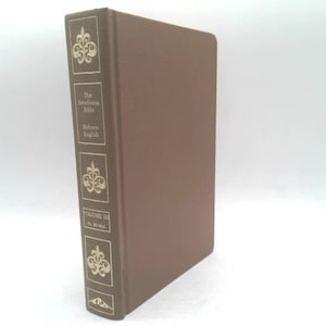 May include: A brown hardcover book titled The Interlinear Bible Hebrew English Volume III Ps 56-166. The spine features gold-colored decorative fleur-de-lis symbols and text detailing the volume number and the range of Psalms included in the book.