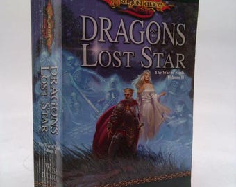 May include: A fantasy novel cover with a blue and white background. The title is "Dragons of a Lost Star" and the subtitle is "The War of Souls, Volume II". The author is Margaret Weis & Tracy Hickman.