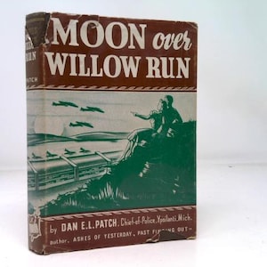 May include: Vintage book titled "MOON over WILLOW RUN" with a brown and white cover. The cover features a green illustration of a couple and airplanes. The author's name and other text are visible.
