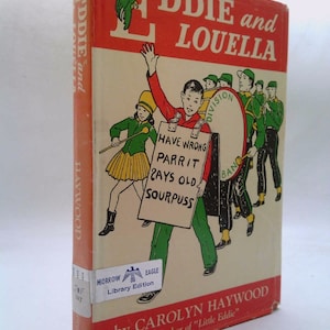 May include: A vintage book cover with a red, white, and green color scheme. The title is "EDDIE and LOUElla" with a large letter "E" featuring a green parrot. The book is by Carolyn Haywood, author of "Little Eddie".