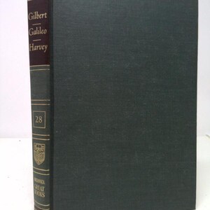 May include: A hardcover book from the Britannica Great Books series. The spine is dark red with gold lettering and the names "Gilbert", "Galileo", and "Harvey". The cover is a dark green color. The number "28" is visible on the spine.