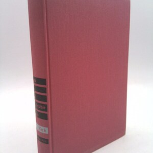 May include: A hardcover book with a textured, reddish-brown cover. The spine features black and white text, including the author's name, "Yeck." The book is slightly angled, showcasing its cover and spine against a white background.