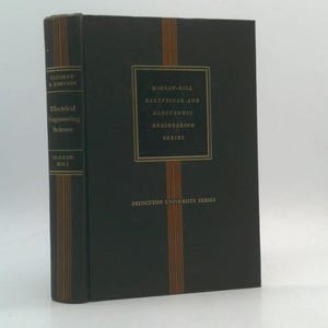May include: A hardcover book with a dark cover and gold lettering. The book's spine features the title "Electrical Engineering Science" and the author's name. The front cover has the text "McGraw-Hill Electrical and Electronic Engineering Series" and "Princeton University Series."