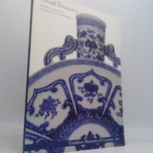 May include: Cobalt Treasures: The Chinese Porcelain of the Gardner Museum. A book cover featuring a close-up of a blue and white porcelain vase with intricate floral designs.