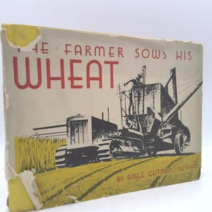 May include: A vintage children's book cover with a yellow background and a black and white illustration of a combine harvester in a field of wheat. The title of the book is "The Farmer Sows His Wheat" in red letters. The author's name, "By Adele Gutman Nathan", is printed in black at the bottom of the cover.