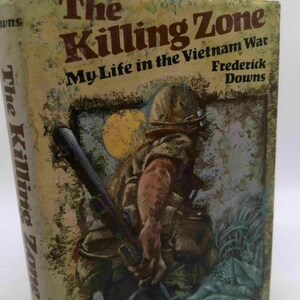 May include: A vintage book titled "The Killing Zone" by Frederick Downs, depicting a soldier in the Vietnam War. The cover features a soldier with a weapon, set against a backdrop of a yellow moon and foliage. The book's title and author are prominently displayed.