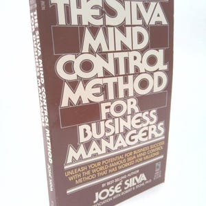May include: A brown book titled "The Silva Mind Control Method for Business Managers" by Jose Silva. The book cover features white text with a brown background.