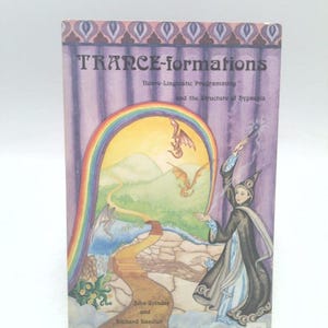 May include: A book titled "TRANCE-formations" with the subtitle "Neuro-Linguistic Programming and the Structure of Hypnosis." The cover features a wizard, a rainbow, and dragons. The authors are John Grinder and Richard Bandler.