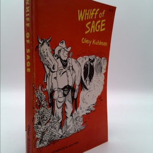 May include: A red book cover with the title "Whiff of Sage" by Oley Kohlman. The cover features a black and white illustration of a cowboy riding a horse.