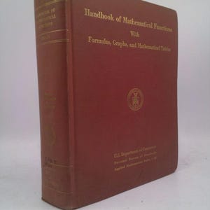 May include: A hardcover book titled "Handbook of Mathematical Functions" with gold lettering. The cover is a reddish-brown color, and the book includes formulas, graphs, and mathematical tables. The book is published by the U.S. Department of Commerce.