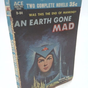 May include: A vintage paperback book cover with a blue background featuring a woman in a blue hooded cloak with a red star on her forehead. The title is "An Earth Gone Mad" and the subtitle is "Was this the end of mankind?" The book is by Roger Dee and is part of the Ace Double Novel Books series.