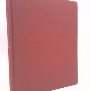 May include: A red hardcover book with the title "The Cranstoc  Cole" printed in white on the spine.