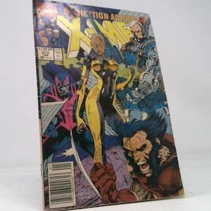 May include: A vintage X-Men comic book featuring a vibrant cover illustration. The cover art showcases several characters in action, including Wolverine, with the title "X-Tinction Agenda" prominently displayed. The comic is in good condition.