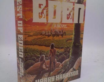 May include: A hardcover book titled "West of Eden: A Novel" by Harry Harrison. The cover art features a landscape with figures and the title in large white letters. The spine also displays the title.