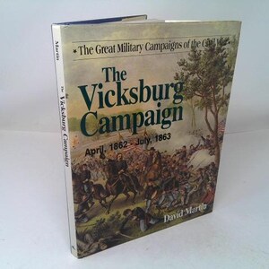 May include: A hardcover book titled "The Vicksburg Campaign" by David Martin. The cover features a historical illustration of a battle scene with soldiers and horses. The title is in large green letters, with the subtitle "April, 1862 - July, 1863".