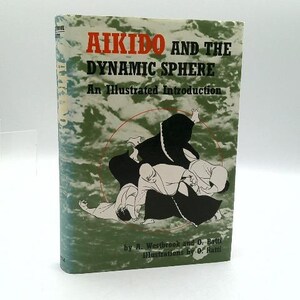 May include: A book titled "Aikido and the Dynamic Sphere: An Illustrated Introduction." The cover features a green and white background with an illustration of figures in black and white. The title is in red.