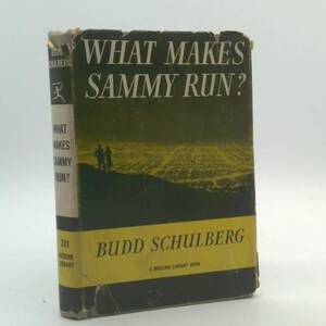 May include: A vintage book titled "What Makes Sammy Run?" by Budd Schulberg. The cover is dark green with white text and a yellow band at the bottom. The book's spine is visible, showing the title and author.