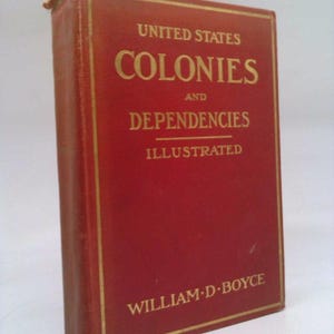 May include: A red hardcover book titled "United States Colonies and Dependencies Illustrated" by William D. Boyce.