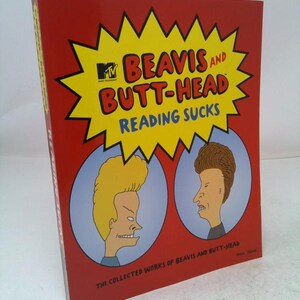 May include: A red book titled Beavis and Butt-Head Reading Sucks with a yellow starburst graphic, the MTV logo, and illustrations of the two characters in blue circles. The text The Collected Works of Beavis and Butt-Head is printed at the bottom.