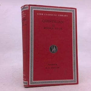 May include: A red hardcover book titled "Quintilian to Books VII-IX" from the Loeb Classical Library. The book has a white and silver border with the series title at the top. The book is translated by H.E. Butler.