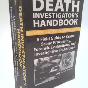May include: A black hardcover book titled Death Investigator's Handbook: A Field Guide to Crime Scene Processing, Forensic Evaluations, and Investigative Techniques by Louis N. Eliopulos, featuring a yellow police barricade tape graphic.