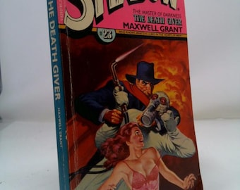 May include: Vintage paperback book titled "The Shadow" with a pink and red cover. The cover art features a man in a hat with a torch, a figure in a gas mask, and a woman in a pink dress. The book is titled "The Death Giver".