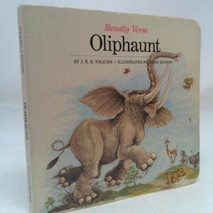 May include: A children's book titled "Olifhaunt" by J.R.R. Tolkien, illustrated by Hank Hinton. The cover features a cartoon illustration of a gray elephant jumping in the air with its trunk raised. The background shows a variety of animals, including a zebra, a gazelle, and a tiger.