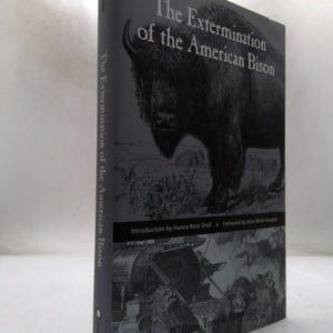 May include: A hardcover book titled The Extermination of the American Bison by William Temple Hornaday. The cover features a black and white illustration of a bison, with an introduction by Hanna Rose Shell and a foreword by John Mack Faragher.