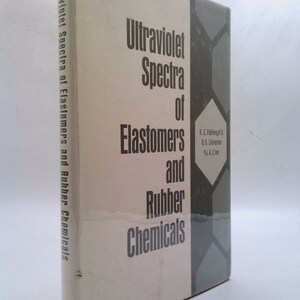 May include: A hardcover book titled "Ultraviolet Spectra of Elastomers and Rubber Chemicals." The book has a white cover with black text and a gray geometric design on the right side. The title is vertically printed on the spine.