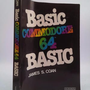 May include: A black book with the title "Basic Commodore 64 BASIC" in white letters. The book is by James S. Coan and published by Hayden.