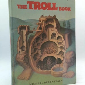 May include: Vintage hardcover book titled "The Troll Book" with a light green cover. The cover features a detailed illustration of a troll-like structure with internal chambers and figures. The title is in red, and the author's name is at the bottom.