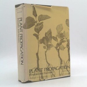 May include: A hardcover book titled Plant Propagation: Principles and Practices by Hartmann and Kester. The cover is light tan with a dark brown illustration of three small plants with visible roots. The title is printed in black text.