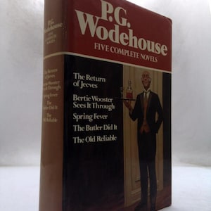May include: A hardcover book titled P.G. Wodehouse Five Complete Novels with a red and black dust jacket. The cover features an illustration of a butler holding a tray and lists the titles The Return of Jeeves, Bertie Wooster Sees It Through, Spring Fever, The Butler Did It, and The Old Reliable.