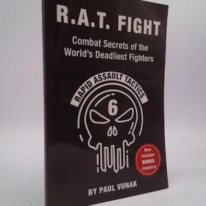 May include: A black book cover with the title "R.A.T. FIGHT" and the subtitle "Combat Secrets of the World's Deadliest Fighters". The cover features a skull graphic with the words "Rapid Assault Tactics" and the number "6" above the skull. The book is by Paul Vunak.