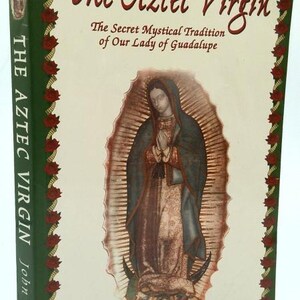 May include: A hardcover book titled "The Aztec Virgin" with the subtitle "The Secret Mystical Tradition of Our Lady of Guadalupe." The cover features an illustration of a religious figure and the author's name, John Mini.