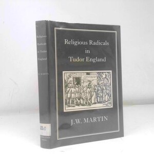 May include: A black hardcover book titled Religious Radicals in Tudor England by J.W. Martin. The front cover features a white rectangular frame containing a detailed black and white historical illustration of a crowd of people in period clothing.
